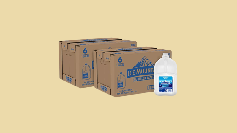 Carton and boxes of water against tan background
