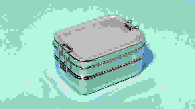 A stainless steel Bento Box with three compartments.
