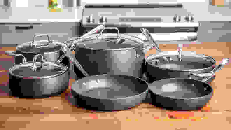 All-Clad HA1 nonstick cookware set displayed on kitchen counter.