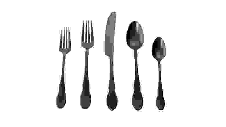 A set of matte black flatware against a white background.