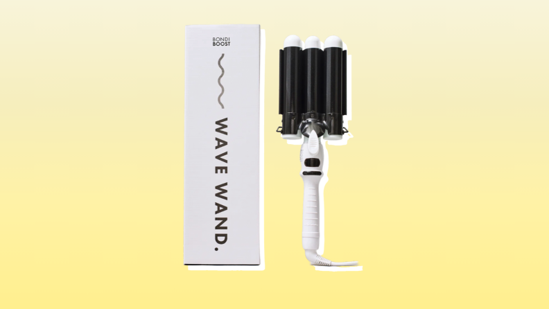 Bondi Boost hair waver in front of a yellow background.