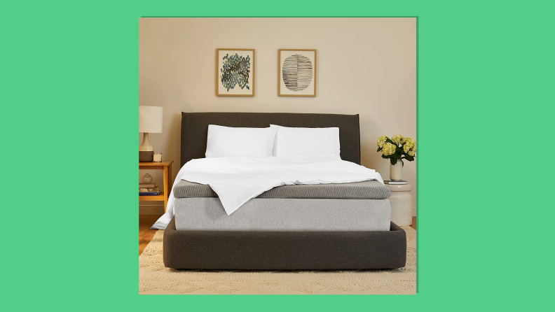 Casper Sleep Comfy Mattress Topper on a green background