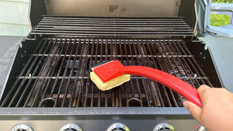 Two views of the Grill Rescue brush with a dirty brush head.