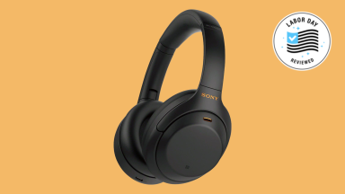 Sony WH-1000XM4 wireless headphones appear over a Reviewed background.