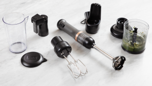 Black & Decker Kitchen Wand surrounded by its attachments on a marble surface