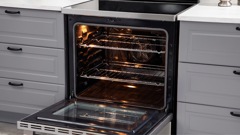 Hisense HBE3501CPS 30-in Freestanding Electric Range with oven door open.