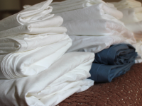 Three stacks of percale sheets